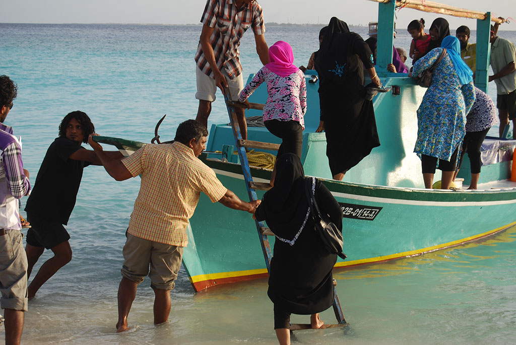 Boarding a ferry on Utheemu beach